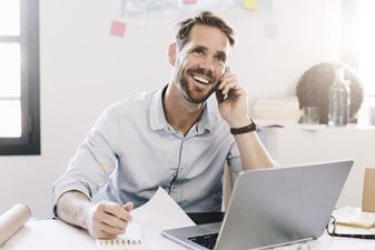 Man talking to other painting franchisees